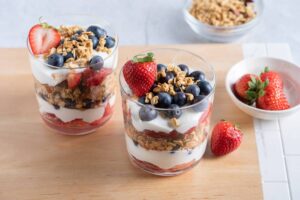 Yogurt and Colorful parfait with berries and granola